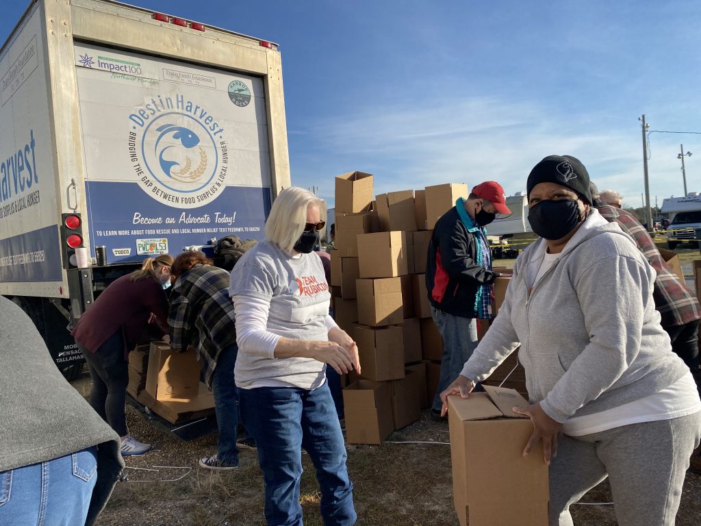 Volunteers setting up food boxes at food distributino